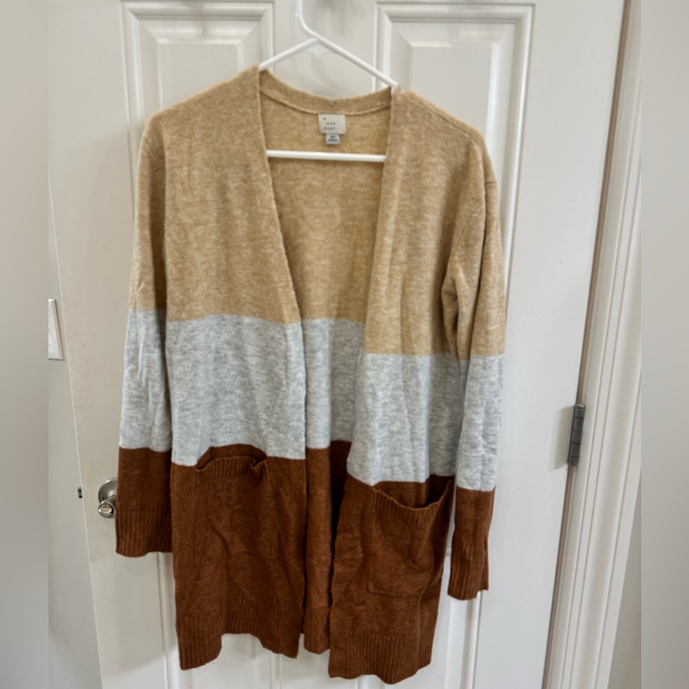 A new day long cardigan only worn once